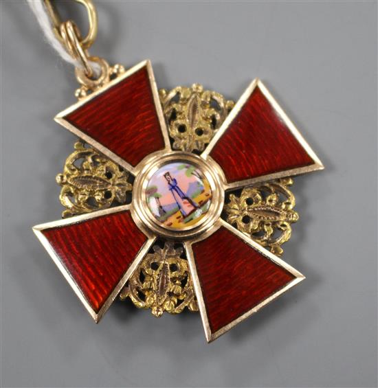 An early 20th century Russian 56 zolotnik yellow metal and enamel cross pendant and an associated 18ct chain, pendant 34mm.